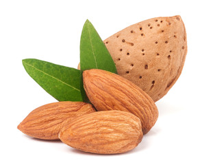 almonds in their skins and peeled with leaf isolated on white background