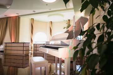 Beautiful white piano in a restaurant