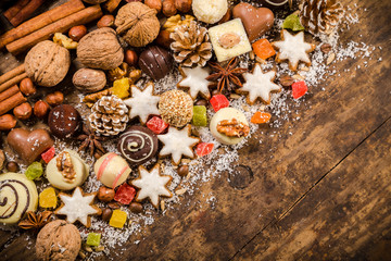 diagonal wooden background with sweets and chocolate
