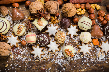 dark wooden background with sweets and chocolate