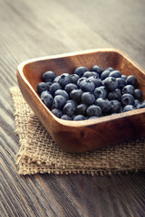 ripe sweet blueberries on wooden table
