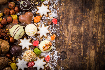 wooden background with sweets and space for text