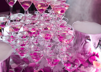 Champagne in glasses with fresh cherry on table - party background