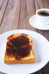 Close up of Australian breakfast with savory spread on a sliced wholewheat toast.  
