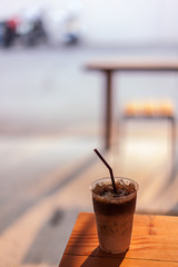 Cup of coffee latte in coffee shop 