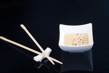Japanese sauce with chopsticks