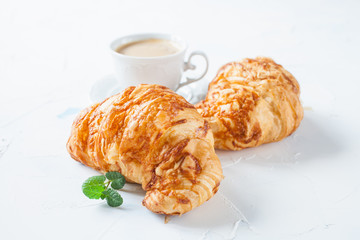 coffee and croissants on a table, selective focus
