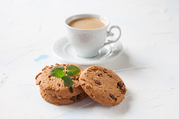 coffee and cookies on a table, selective focus