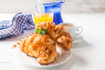 coffee and croissants on a table, selective focus