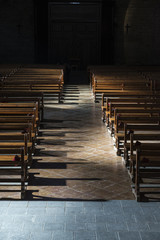 Row of wooden benches inside a church