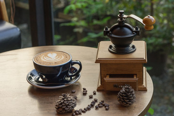 wooden traditional coffee maker with hot coffee coffee seed on wooden table in coffee shop on natural view at relax coffee time / coffee maker and hot coffee