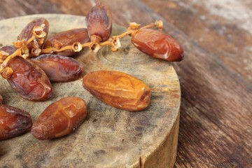 Dried date palm. fruit  Delicious fresh organic on the wooden