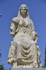 Fototapeta na wymiar Copy Of The Statue Of The Goddess Ceres at the entrance to the preserved Roman town of Merida, Spain 