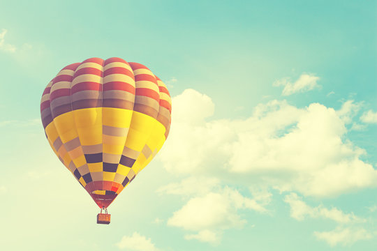 Hot air balloon on sun sky with cloud, vintage and retro instagram filter effect style