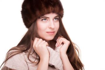 Woman in winter outfit looking away