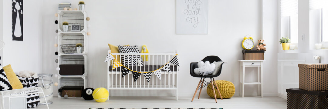 Modern baby room with yellow and black decoration