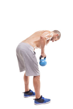 Full Body Of A Fit Man Lifting A Kettle Bell, Isolated On White