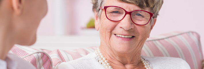 Happy senior lady wearing eyeglasses