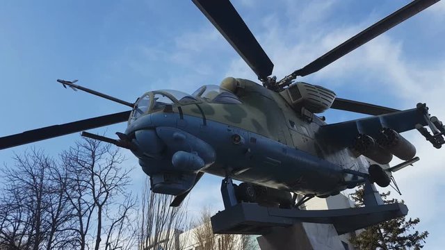 Russian helicopter Mi - 24 monument. Military combat transport helicopter in classic camouflage color