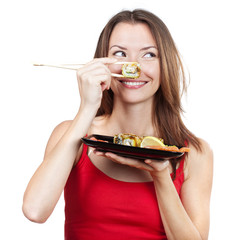 beautiful brunette woman holding sushi