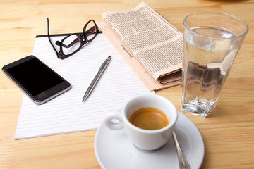 Cup of Coffee and Newspaper