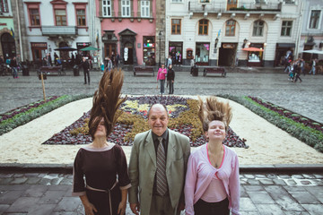 Father and his daughters posing in the old town
