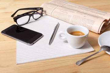 Cup of Coffee and Newspaper