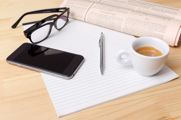 Cup of Coffee and Newspaper