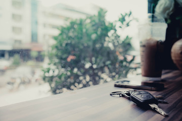 Key smartphone and ice coffee in cafe.Hi-key picture and soft fo