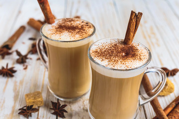 Two cups of cappuccino, anise and cinnamon