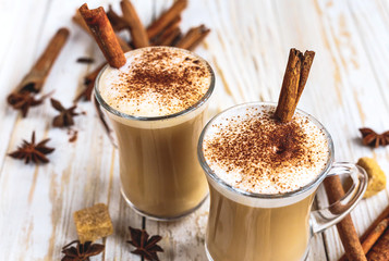 Two cups of cappuccino, anise and cinnamon