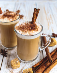 Two cups of cappuccino, anise and cinnamon
