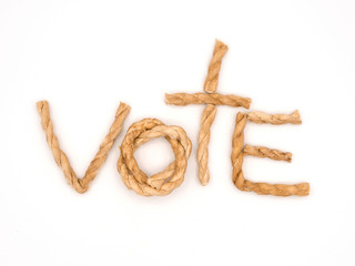 the word vote place in the center of the frame by pieces of brow