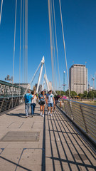 People walking on a bridge in London