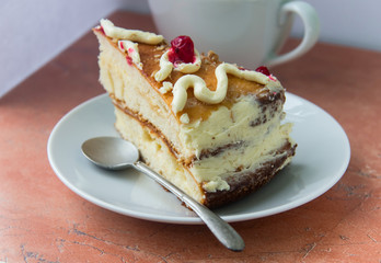 Homemade cake in white plate and tea