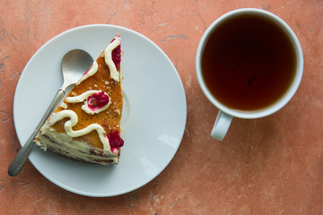 Homemade cake in white plate and tea