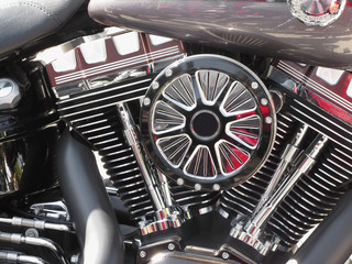 Motorcycle chromed engine closeup detail background