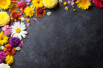 Garden flowers over stone table background