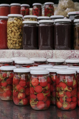 Jars of pickled vegetables in the farmers market
