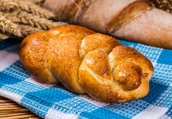 assortment of baked bread on wood table