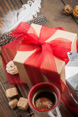 cup of coffee, gift with red ribbon, brown sugar
