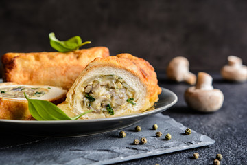 Fried rolls coated in batter and stuffed with mushroom, cheese, onion and parsley   