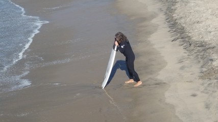 Surfer at the Beach in the Ocean 