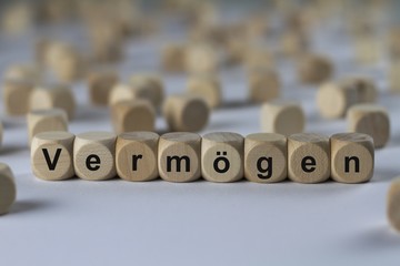 Vermögen - Holzwürfel mit Buchstaben