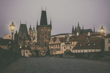 View from Charles bridge in Prague with red roofs, Czech Republic. Toned photo, vintage effect.