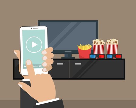 Hand holding a remote controller. There is a "play" button on the display of the remote controller in the picture. There is also a home cinema, curbstone,  3D glasses, popcorn, french fries