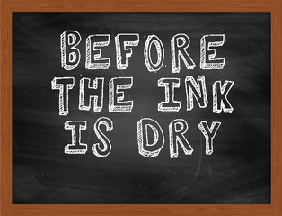 BEFORE THE INK IS DRY handwritten text on black chalkboard