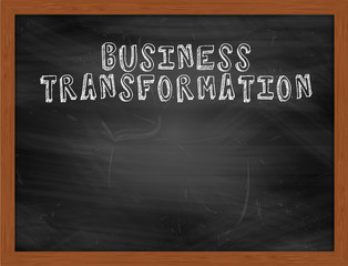 BUSINESS TRANSFORMATION handwritten text on black chalkboard