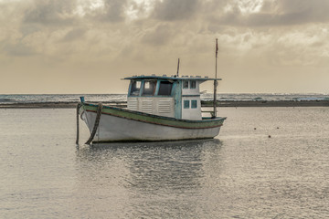 Obraz premium Small Ship at Ocean Porto Galinhas Brazil