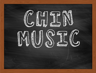 CHIN MUSIC handwritten text on black chalkboard